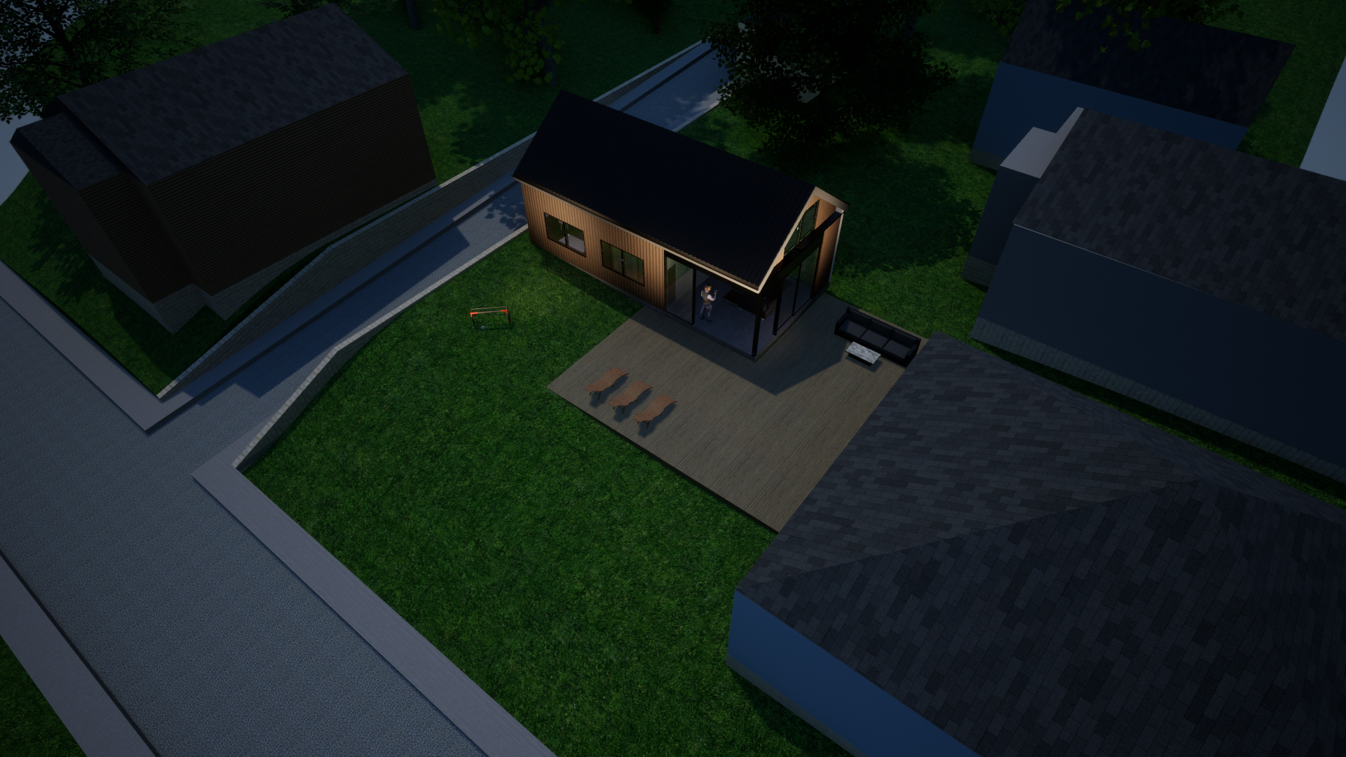 Dusk aerial — the ADU in its lot