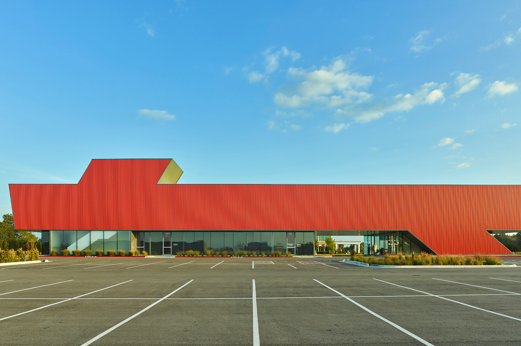 Red corrugated metal facade precedent