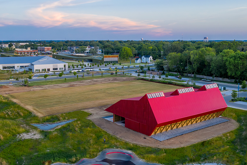 Red barn pavilion precedent in landscape